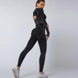 Woman Wearing Seamless Yoga Power Set Black